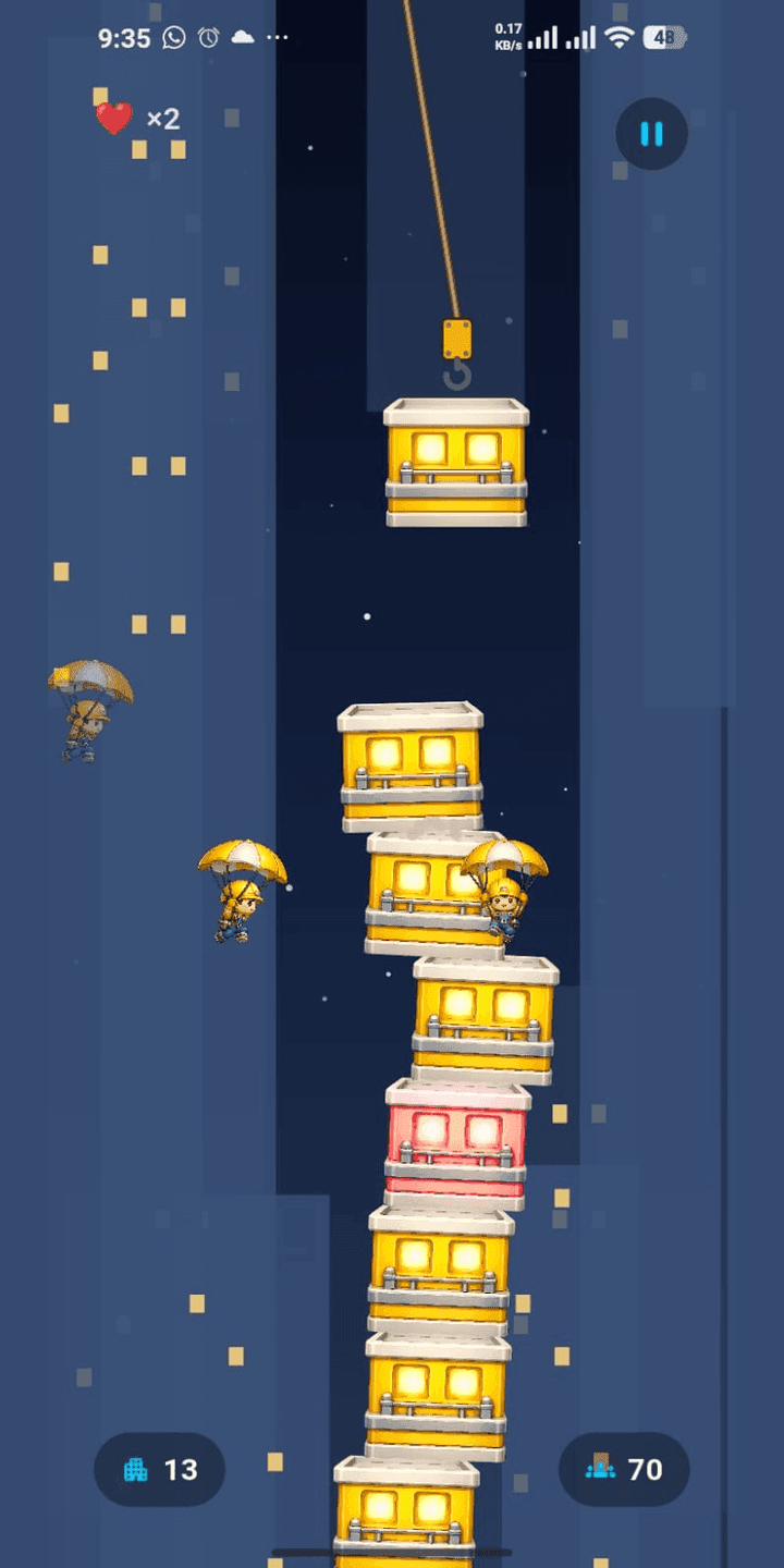 A tall tower of floors with parachuting residents